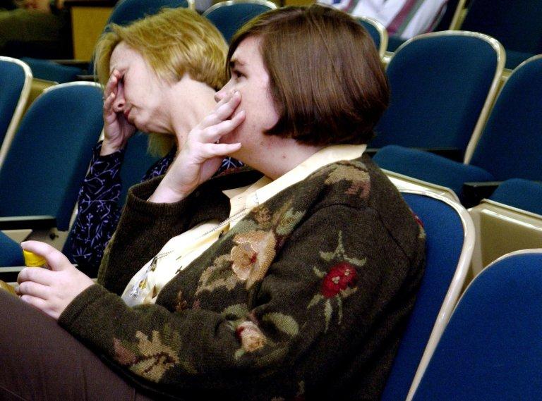 KENNEDY SPACE CENTER, FLA. - Employees at KSC reveal emotion as they watch the memorial service for the fallen seven astronauts of Columbia being held at Johnson Space Center, Houston, and broadcast on NASA television. .