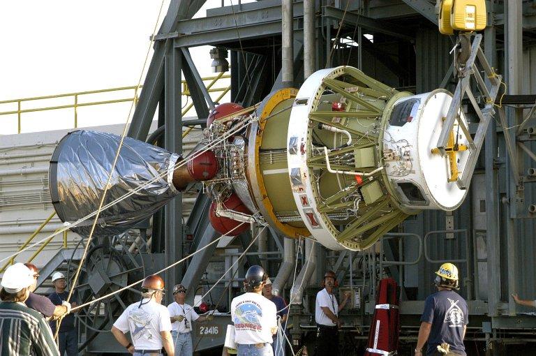 KENNEDY SPACE CENTER, FLA. - The second stage of the Delta II rocket is raised off the transporter for its lift up the launch tower on Pad 17-A, Cape Canaveral Air Force Station. It will be mated to the first stage in preparation for the launch of the Mars Exploration Rover 2 (MER-A). The MER Mission consists of two identical rovers designed to cover roughly 110 yards each Martian day over various terrain. Each rover will carry five scientific instruments that will allow it to search for evidence of liquid water that may have been present in the planet?s past. Identical to each other, the rovers will land at different regions of Mars. Launch date for this first of NASA?s two Mars Exploration Rover missions is scheduled June 5.