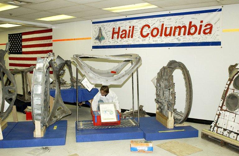 KENNEDY SPACE CENTER, FLA. - Richard Risley, with United Space Alliance, places a box of Columbia debris in its final resting place in the Vehicle Assembly Building (VAB). All of the pieces received and collected in the Columbia Reconstruction Hangar have been catalogued and moved to a permanent site in the VAB.