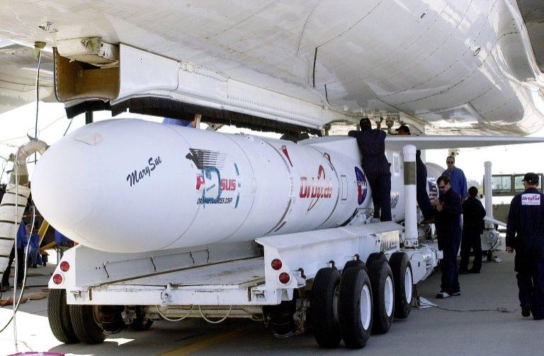 VANDENBERG AIR FORCE BASE, CALIF. - Workers mate the Pegasus , with its cargo of the SciSat-1 payload to the L-1011 carrier aircraft. The SciSat-1 weighs approximately 330 pounds and after launch will be placed in a 400-mile-high polar orbit to investigate processes that control the distribution of ozone in the upper atmosphere. The data from the satellite will provide Canadian and international scientists with improved measurements relating to global ozone processes and help policymakers assess existing environmental policy and develop protective measures for improving the health of our atmosphere, preventing further ozone depletion. The mission is designed to last two years.