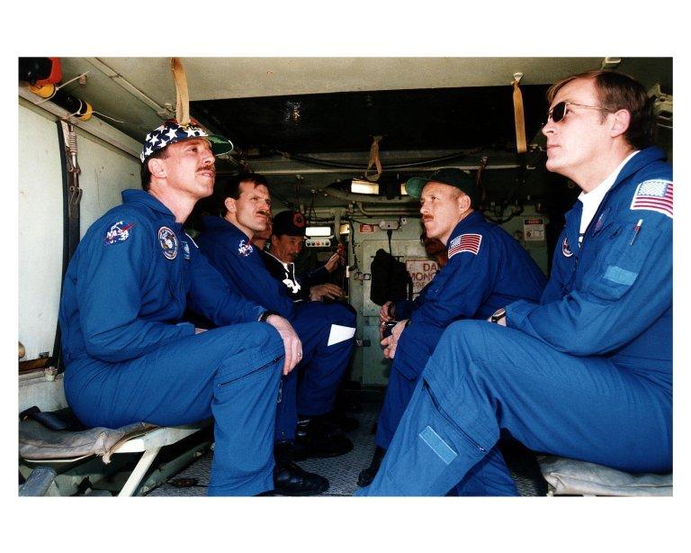 STS-82 crew members ride in and learn how to operate an M-113 armored personnel carrier during Terminal Countdown Demonstration Test (TCDT) activities prior to launch. The four crew members dressed in their blue flight suits and visible here are, from left, Pilot Scott J. "Doc" Horowitz, Mission Specialist Joseph R. "Joe" Tanner, Mission Commander Kenneth D. Bowersox and Payload Commander Mark C. Lee. George Hoggard, a training officer with KSC Fire Services, is visible in the background at left. The 10-day STS-82 flight, which will be the second Hubble Space Telescope servicing mission, is targeted for a Feb. 11 liftoff